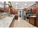 Modern kitchen with stainless steel appliances and granite counters at 2200 W Bay Isle Se Dr, St Petersburg, FL 33705