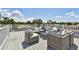 Relaxing rooftop deck with wicker furniture and city views at 2200 W Bay Isle Se Dr, St Petersburg, FL 33705