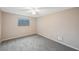 Well-lit bedroom with gray carpet and ceiling fan at 8887 124Th Way, Seminole, FL 33772