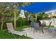 Relaxing backyard patio with shaded seating area, grill, and lush landscaping at 4631 42Nd N Ave, St Petersburg, FL 33714