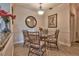 Cozy dining area with a glass-top table and wicker chairs at 2732 Via Murano # 526, Clearwater, FL 33764