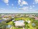 Aerial view of community pool, tennis court, and clubhouse at 448 Stone Briar Dr, Ruskin, FL 33570