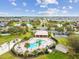 Aerial view of community amenities including pool, playground, and tennis courts at 448 Stone Briar Dr, Ruskin, FL 33570