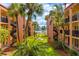 Lush courtyard with a relaxing patio area at 8911 Blind Pass Rd # 305, St Pete Beach, FL 33706
