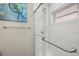 Updated walk-in shower with subway tile and glass enclosure at 8911 Blind Pass Rd # 305, St Pete Beach, FL 33706