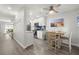 Open concept kitchen and dining area with modern finishes at 8911 Blind Pass Rd # 305, St Pete Beach, FL 33706