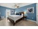 Relaxing bedroom with a king-size bed and blue accents at 8911 Blind Pass Rd # 305, St Pete Beach, FL 33706