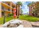 Community patio with seating and grill at 8911 Blind Pass Rd # 305, St Pete Beach, FL 33706