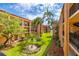Landscaped courtyard with tropical plants at 8911 Blind Pass Rd # 305, St Pete Beach, FL 33706
