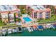 Aerial view of waterfront community with pool and boat slips at 8911 Blind Pass Rd # 305, St Pete Beach, FL 33706