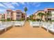 Wooden community dock with benches at 8911 Blind Pass Rd # 305, St Pete Beach, FL 33706