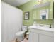 Clean bathroom with shower/tub combo, white vanity, and tile floor at 8911 Blind Pass Rd # 305, St Pete Beach, FL 33706