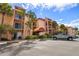 Two-story building with ample parking and tropical landscaping at 8911 Blind Pass Rd # 305, St Pete Beach, FL 33706
