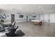 Community room with pool table and seating area at 8911 Blind Pass Rd # 305, St Pete Beach, FL 33706