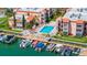 Aerial view of waterfront community with pool and boat slips at 8911 Blind Pass Rd # 305, St Pete Beach, FL 33706