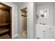 Updated bathroom with white vanity, shower, and sauna at 8911 Blind Pass Rd # 305, St Pete Beach, FL 33706