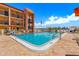 Inviting swimming pool with lounge chairs at 8911 Blind Pass Rd # 305, St Pete Beach, FL 33706