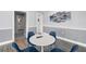 Small common area with table and chairs at 8911 Blind Pass Rd # 305, St Pete Beach, FL 33706