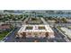 Aerial view of a condo building with ample parking at 8911 Blind Pass Rd # 305, St Pete Beach, FL 33706