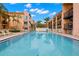 Relaxing community pool surrounded by lounge chairs at 8911 Blind Pass Rd # 305, St Pete Beach, FL 33706