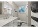 Updated bathroom with stackable washer and dryer at 8911 Blind Pass Rd # 305, St Pete Beach, FL 33706