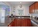 Modern kitchen with stainless steel appliances and granite counters at 5134 Salmon Se Dr # A, St Petersburg, FL 33705