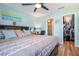Main bedroom with large bed, ensuite bathroom, and walk-in closet at 5134 Salmon Se Dr # A, St Petersburg, FL 33705