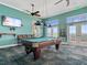 Well-equipped game room featuring a pool table and large TV at 5134 Salmon Se Dr # A, St Petersburg, FL 33705