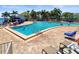 Resort-style pool with plenty of seating and a spa at 5134 Salmon Se Dr # A, St Petersburg, FL 33705