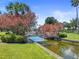 Landscaped footbridge over canal with flowering trees at 5134 Salmon Se Dr # A, St Petersburg, FL 33705