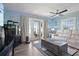 Living room with lake view, comfy seating, and access to the patio at 5134 Salmon Se Dr # A, St Petersburg, FL 33705