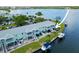 Aerial view of waterfront property with private boat dock and lush landscaping at 5134 Salmon Se Dr # A, St Petersburg, FL 33705