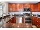 Modern kitchen with stainless steel appliances and granite counters at 5134 Salmon Se Dr # A, St Petersburg, FL 33705