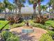 Community courtyard with fountain and tropical landscaping at 5134 Salmon Se Dr # A, St Petersburg, FL 33705