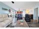 Open concept living room with comfortable seating and kitchen access at 5134 Salmon Se Dr # A, St Petersburg, FL 33705