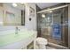 Bathroom with glass-enclosed shower and modern sink at 5134 Salmon Se Dr # A, St Petersburg, FL 33705