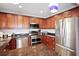 Modern kitchen with stainless steel appliances and granite counters at 5134 Salmon Se Dr # A, St Petersburg, FL 33705