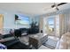 Spacious living area with lake view, fireplace and large TV at 5134 Salmon Se Dr # A, St Petersburg, FL 33705