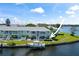 Aerial view of waterfront property with private boat dock and lush landscaping at 5134 Salmon Se Dr # A, St Petersburg, FL 33705