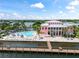 Community pool with adjacent clubhouse and waterfront views at 5134 Salmon Se Dr # A, St Petersburg, FL 33705