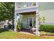 Ground floor patio with seating area, lush landscaping, and access to waterfront at 5134 Salmon Se Dr # A, St Petersburg, FL 33705