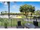 Relaxing balcony with seating, overlooking the water and parking at 7050 Sunset S Dr # 104, South Pasadena, FL 33707