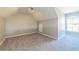 Spacious bedroom with grey carpet, ceiling fan, and large window at 9028 Lake Chase Island Way, Tampa, FL 33626