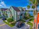 Green two story townhouse near a lake at 9028 Lake Chase Island Way, Tampa, FL 33626