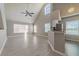 Spacious living room with high ceilings, an open floor plan, and lots of natural light at 9028 Lake Chase Island Way, Tampa, FL 33626