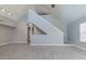 Bright living room with high ceilings, grey walls, and wood-look floors at 9028 Lake Chase Island Way, Tampa, FL 33626