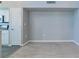 Empty dining area with grey walls and wood-look floors at 9028 Lake Chase Island Way, Tampa, FL 33626