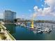 Aerial view of a boat slip in a marina with multiple yachts and waterfront property at 5120 Marina Way # 0000, Tampa, FL 33611