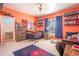 Cozy bedroom with a twin bed and colorful decor at 10177 Sunburst Ct, Spring Hill, FL 34608