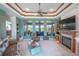 Spacious living room with a fireplace and access to the lanai at 10177 Sunburst Ct, Spring Hill, FL 34608